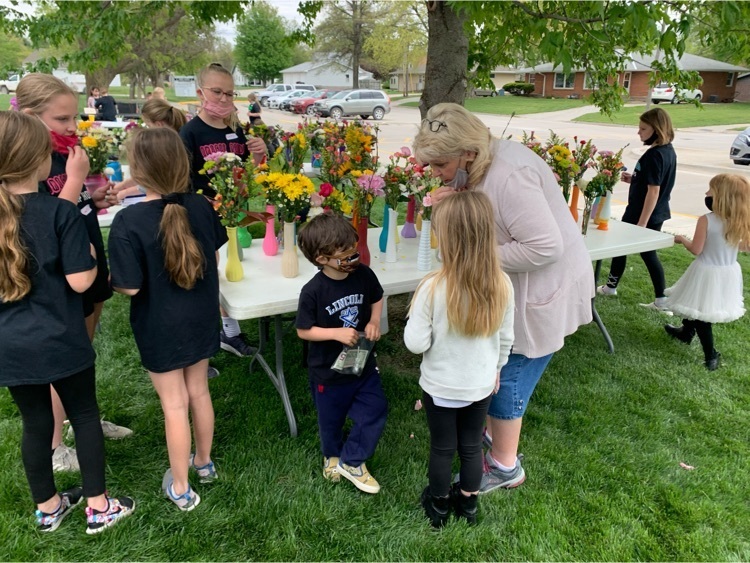 V.A.M. (Vases and More) spent the morning learning from a professional florist and put together 99 floral arrangements which completely sold out
